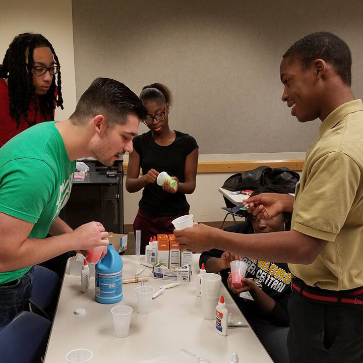 Upward Bound students at ATS Chemistry class doing an activity with slime.